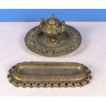 A French brass ink well together with a brass pen tray, 22cm dia. and 28cm long