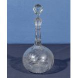 An etched glass wine decanter