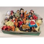 A box of assorted traditional dress dolls and others