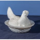 An end of day glass hen basket, 18cm