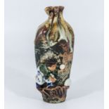 A Japanese Meiji period pottery vase with a figure of a boy playing with a ball moulded to the body,