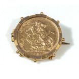 A Victorian 1892 gold sovereign set in an 18ct gold mount, total weight 10.92gms