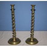 A pair of tall twist brass candlesticks, 40cm tall