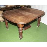 A Victorian mahogany wind out dining table with two extra leaves. 140cm long x 115cm wide, leaves