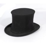 A collapsible top hat, makers name Bennetts of Regent St. London. Measurements front to back 20cm,