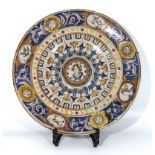 Antique majolica pottery charger of large size, finely decorated with roundels to the borders