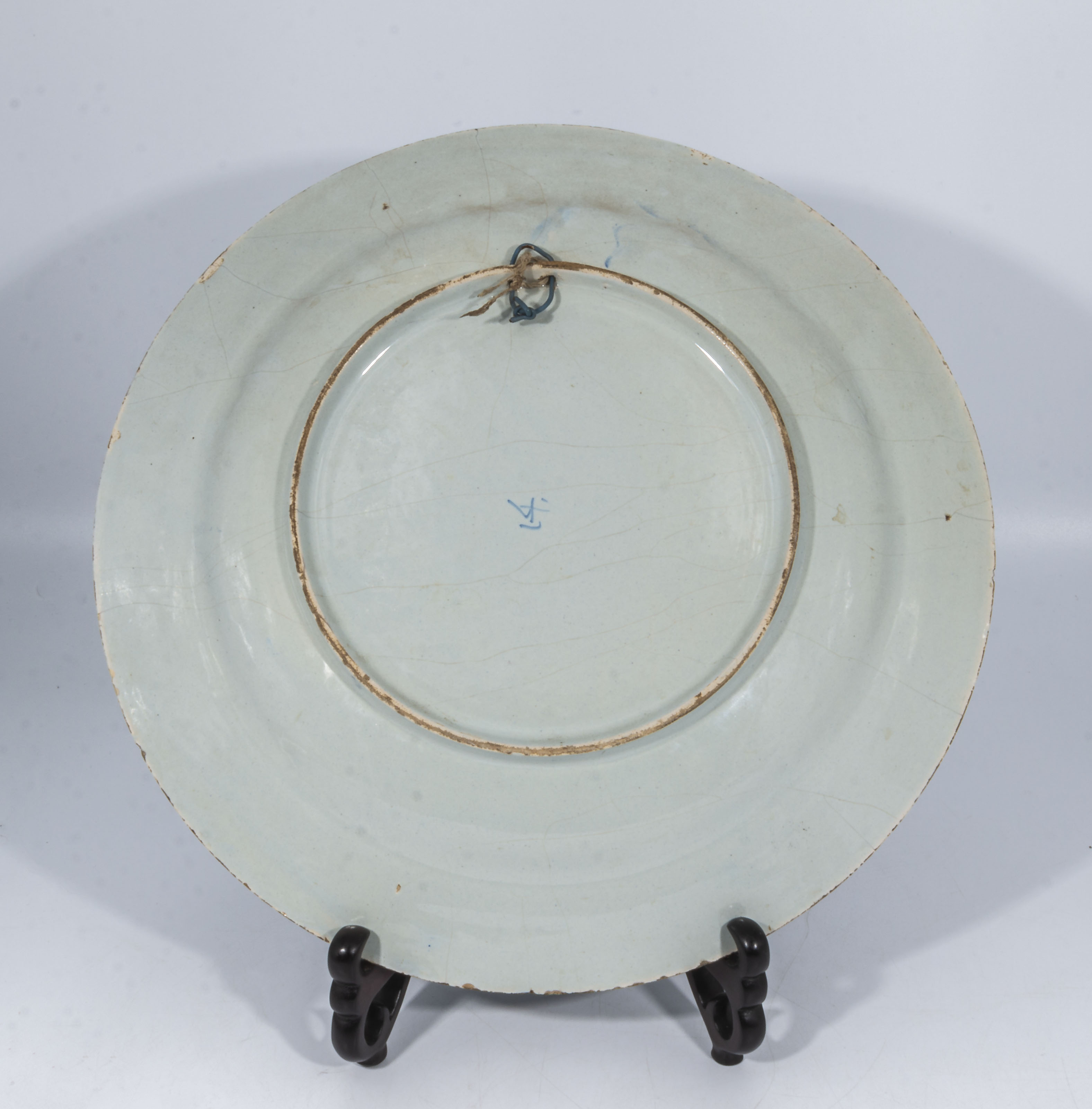 Antique delftware pottery charger with unusual painted decoration, the centre panel depicting a - Image 2 of 3