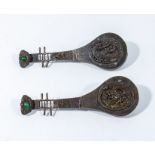 A pair of antique Chinese Qing dynasty bronze cabinet locks in the shape of musical instruments,