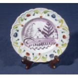 A small Sunderland lustre child's plate, with a moulded floral decorated border, the centre picked