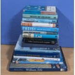 A box of books relating to sailing, yachting and navigation