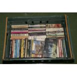 A box containing classic fiction paperback books