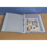 A folder containing assorted stamps