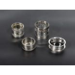 Four silver napkin rings, various makers and dates. Total weight 57gms