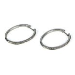 A pair of 9ct white gold diamond hoop earrings 5.7gms