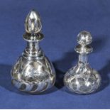 Two antique silver onlaid French scent bottles, in the Art Nouveau taste, decorated to the body with