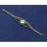 A French 1930's silver marcasite Art Deco ladys wrist watch with articulated strap in the form of