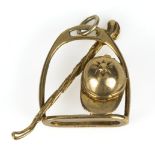 A 9ct gold stirrup, crop and cap pendant 4gms
