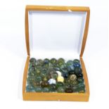 A box full of large vintage marbles various types