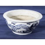 Chinese antique blue and white decorated bowl, depicting a coiled dragon around the body chasing the