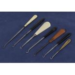 Collection of seven antique lace hooks, with bone, ebony and Bakelite handles 9" to 5" in length.