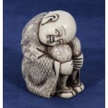 Ivorine Oriental figure of a boy sleeping. 3" high 2" wide