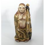 Japanese antique Satsuma figure of a sage, carrying a sack on his back, finely decorated in gilt