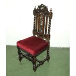 A Victorian carved chair with barley twist legs