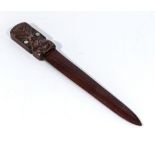 New Zealand interest carved wood paper knife, carved with a head with shell eyes stamped carved in