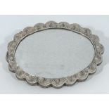 Middle Eastern antique silver heavy quality oval shaped embossed mirror on a chain, finely decorated