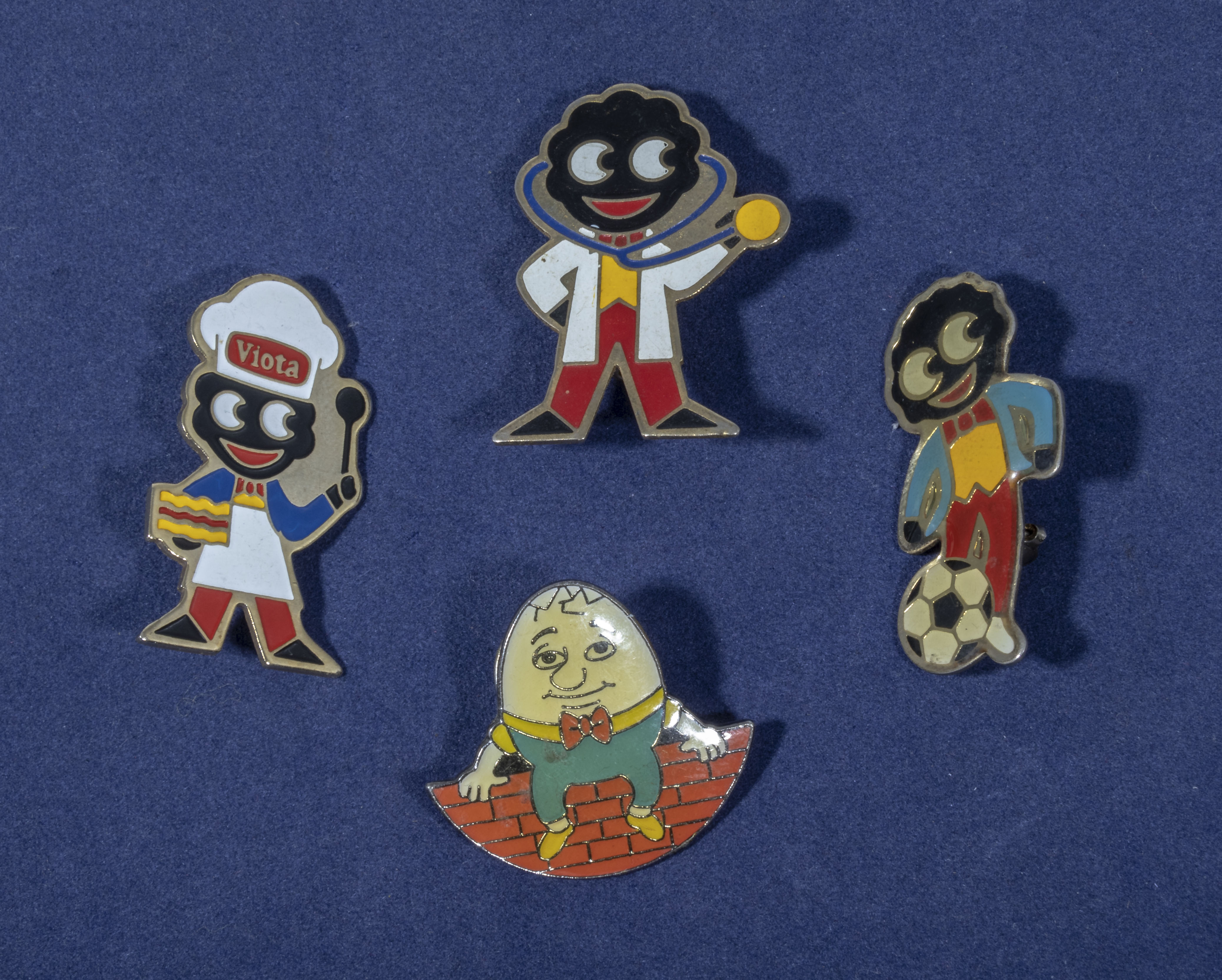 Four vintage Robertsons jam enamel badges. footballer, doctor, baker and humpty dumpty badge.