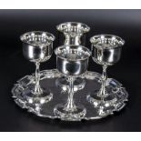 Four silver plated goblets and a tray