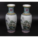 Chinese republic period pair of decorated vases depicting river landscapes, picked out in coloured