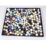 A box full of antique opaque marbles various sizes