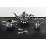 An Indian silvered metal three piece tea service, marked 'SILVER' 47oz, lid to teapot loose