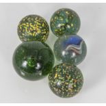 Five extra large glass marbles