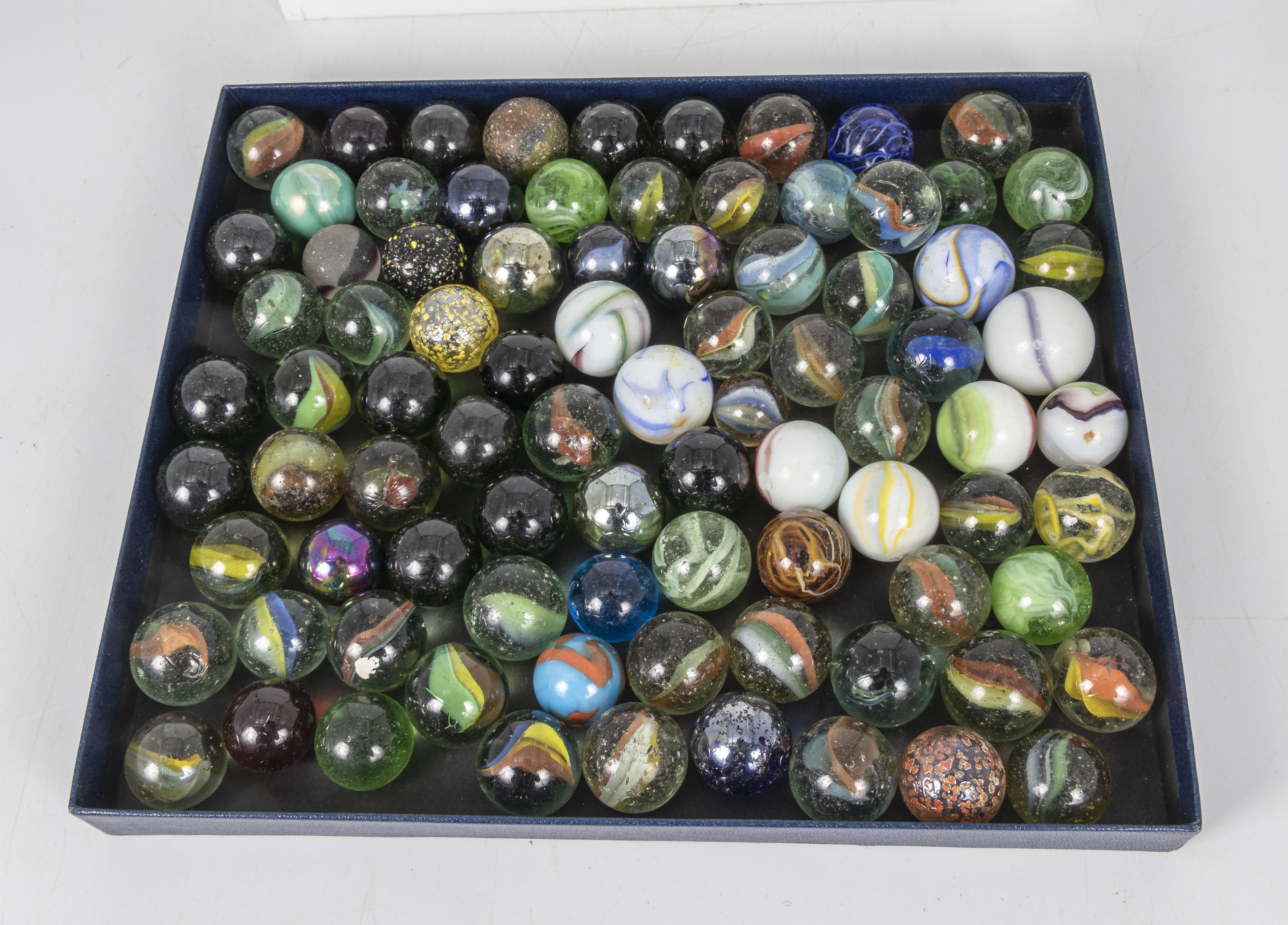 A box full of vintage large size marbles, mixed variations