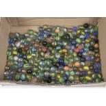 A bag full of vintage single self coloured marbles