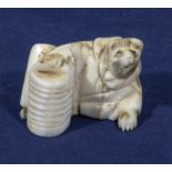 Antique Meiji period Japanese carved ivory netsuke depicting a fox in clothing holding a lantern.