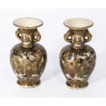A small pair of antique Japanese Satsuma vases of bulbous shape, decorated to the body with monks in
