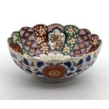 Japanese antique Imari fluted edge footed bowl, decorated in the Imari palette. dia 8"