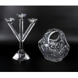 A three branch glass candlestick and a basket