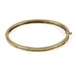 A 9ct gold bangle set with 1ct of diamonds 13.8gms