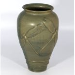 Art pottery green glazed vase of fine quality, carved to its body two dragon flies of large size,