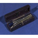 Rare unusual safety pocket curler, patent housed in a leather travelling case with compartment