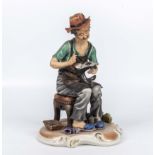 A Capodimonte figure of a cobbler