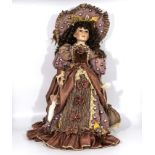 Large standing doll dressed in elegant clothing wearing a large hat, bisque head and hands. 24"high