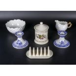 A pair of Spode blue and white candlesticks, a porcelain cream and sugar, lidded pot and a toast