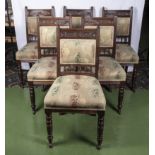 A set of six Victorian upholstered dining chairs