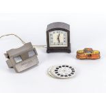 A vintage Viewmaster with slides, Bakelite clock and a playworn tin toy
