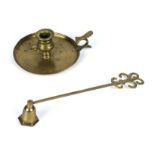 A brass candlestick and a snuffer